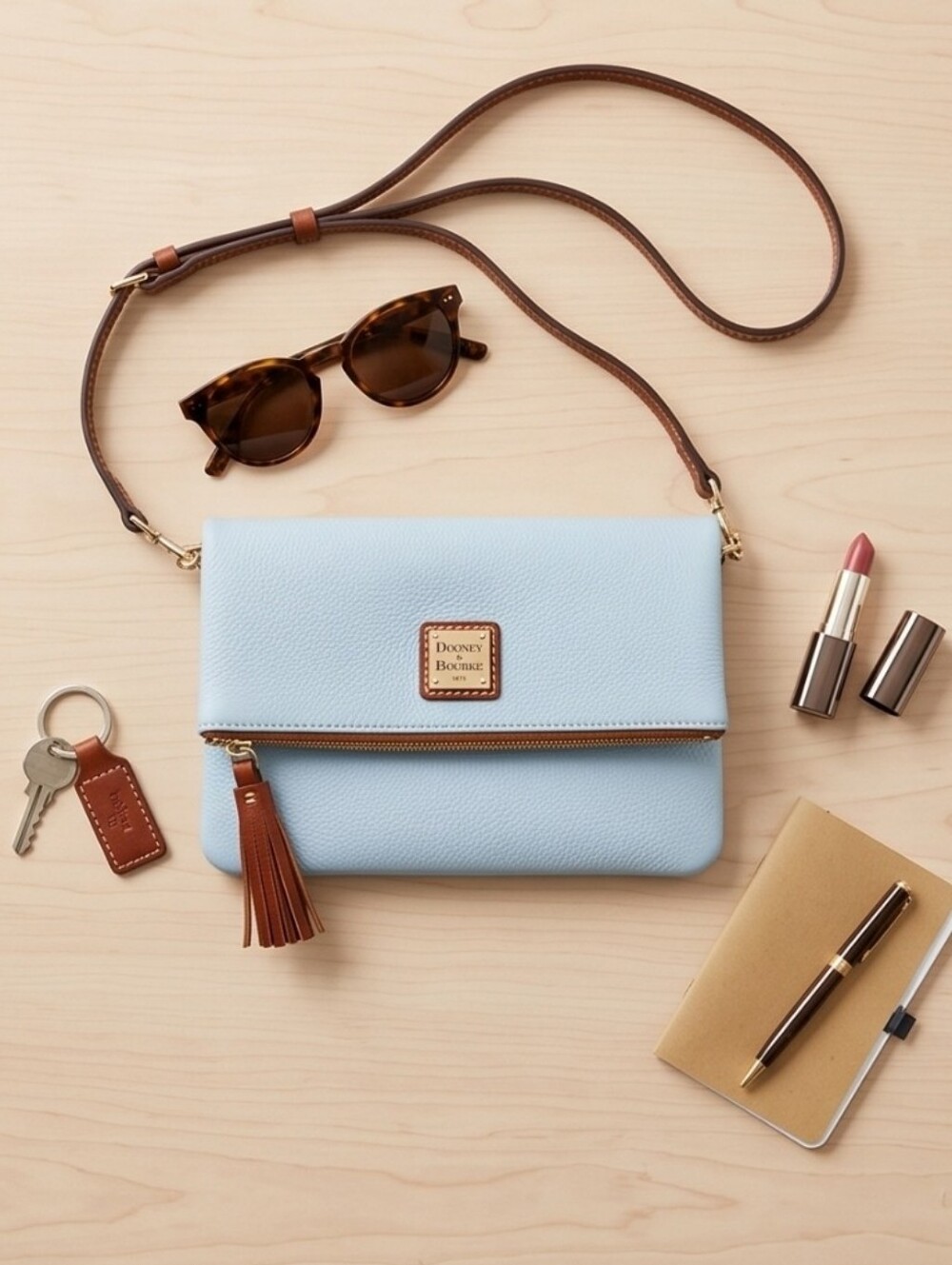 Dooney & Bourke Pale Blue Leather Crossbody with Brown Strap and Tassel